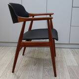 Vintage armchair in teak and black leather model Casina 60s