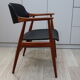 Vintage armchair in teak and black leather model Casina 60s
