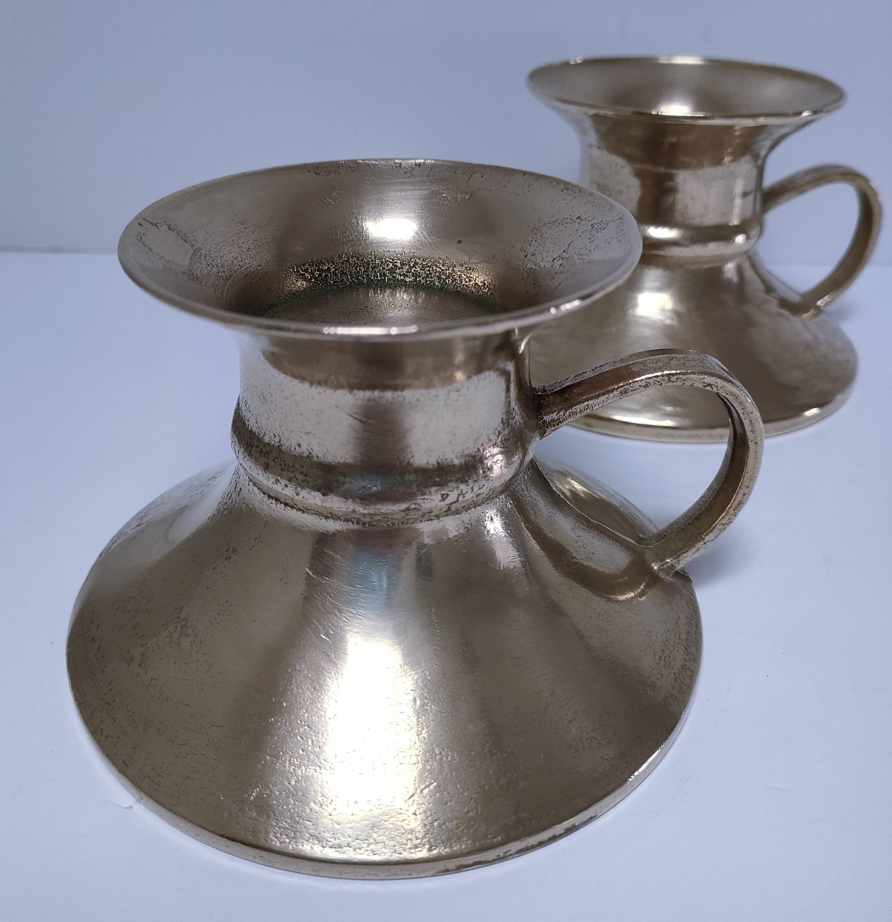 Pair of vintage solid brass hand candlesticks