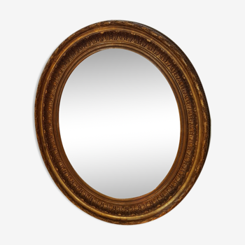 Oval mirror in wood and stucco style Louis XVI of the nineteenth 77x97cm