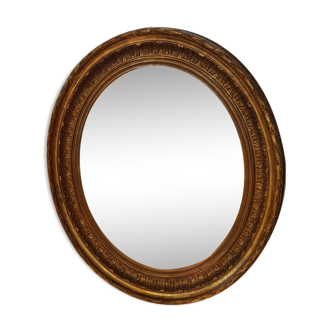 Oval mirror in wood and stucco style Louis XVI of the nineteenth 77x97cm