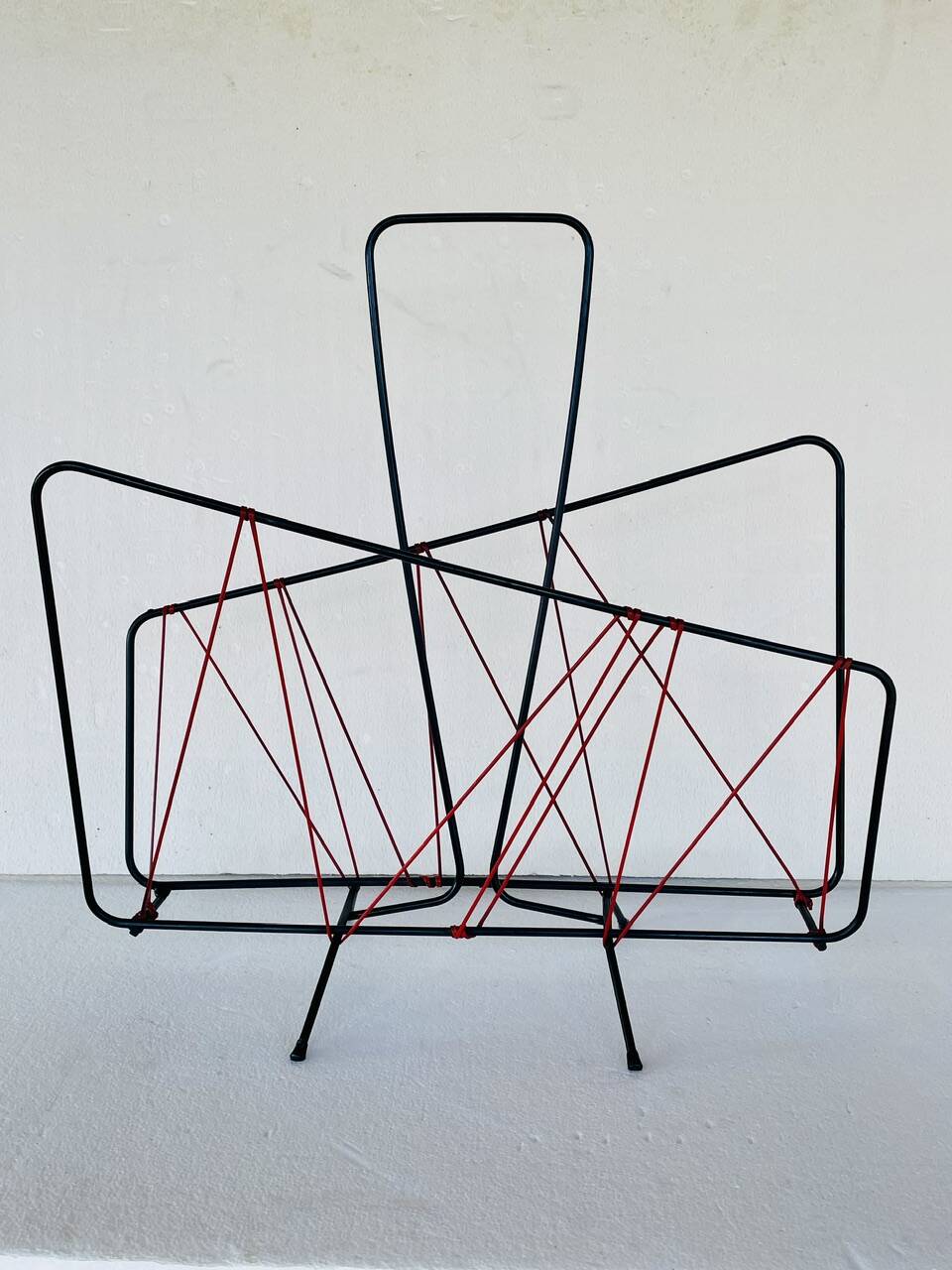 Vintage black metal magazine rack circa 19