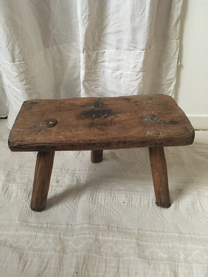 Crude wooden tripod stool