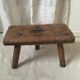 Crude wooden tripod stool