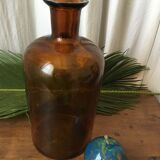 Old thick glass amber bottle