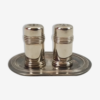 Salt and pepper on silver metal tray