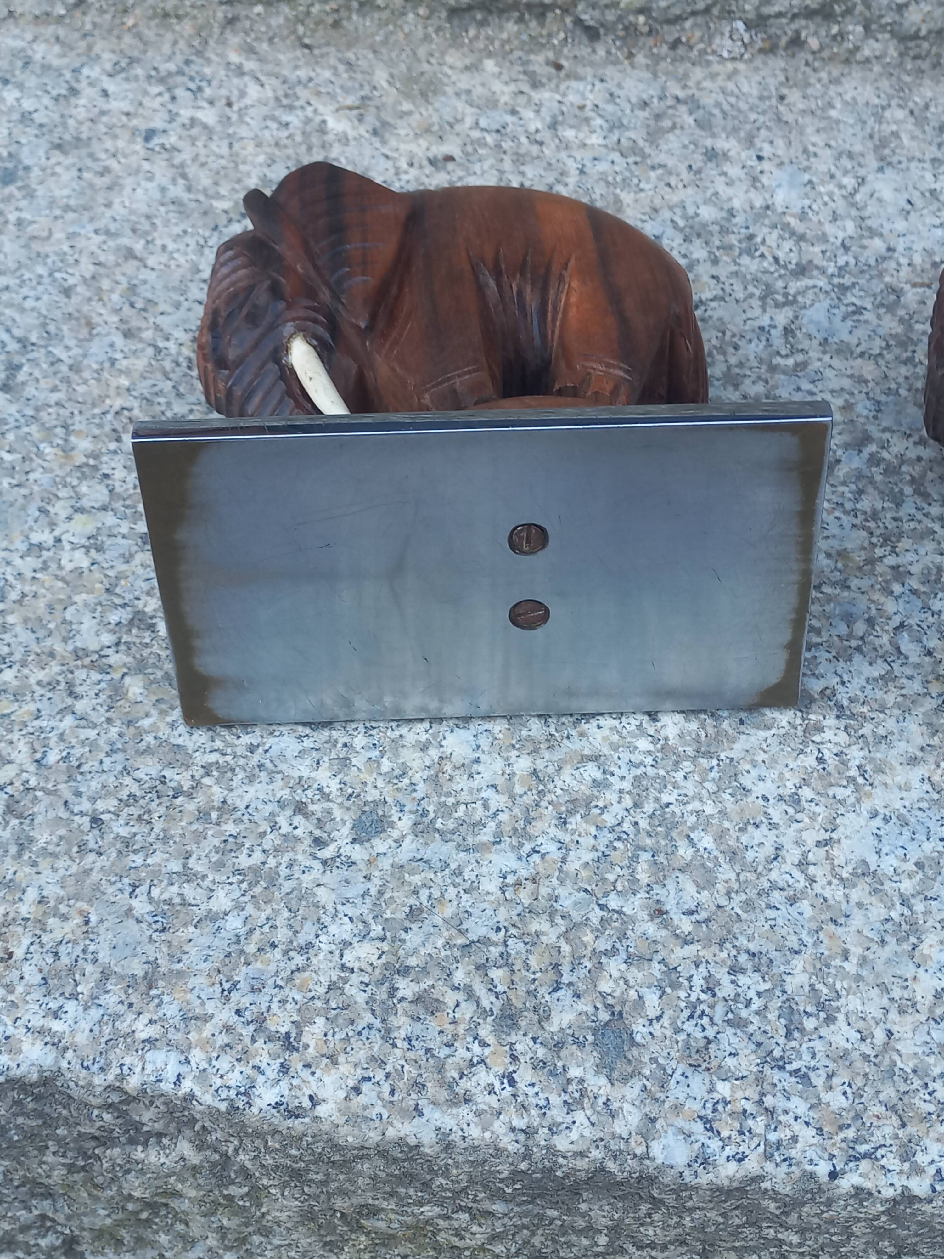 Pair of Art Deco elephant bookends in rosewood with chrome base.