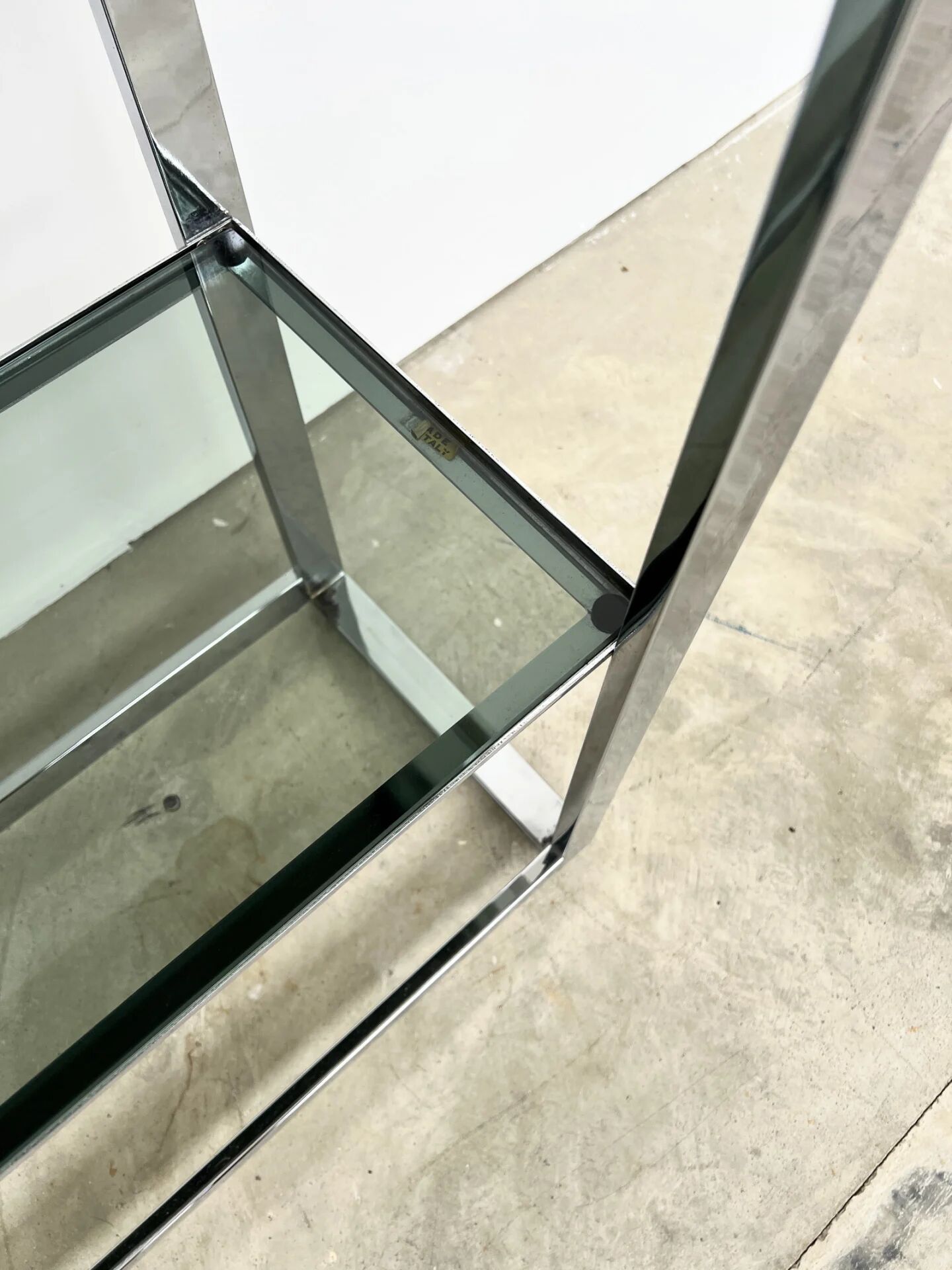 Chrome bookshelf with smoked glass — Italy, 1970s