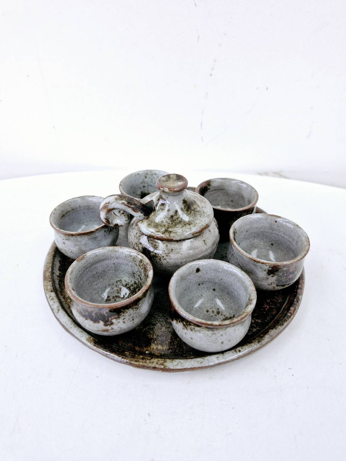 Vintage enameled stoneware service with 6 small bowls and a sugar bowl or sauce bowl