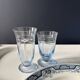 Set of 32 vintage glacier blue engraved stemmed glasses.
