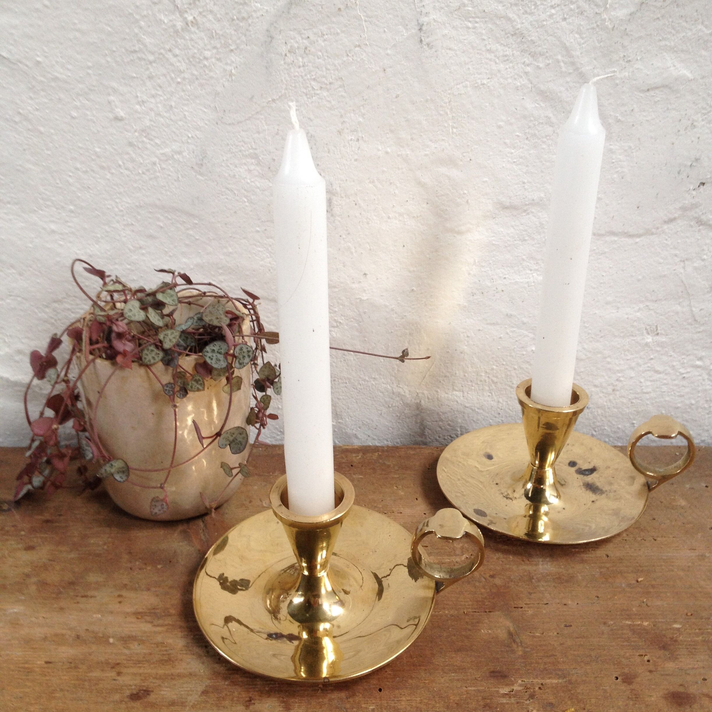 Pair of brass cellar rat candlesticks