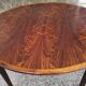 Extended rosewood round table
