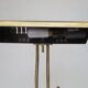 Old aged brass articulated desk lamp