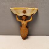 Wall lamp, where the base is a carved wooden lady holding the shade which is made of alabaster 1920s