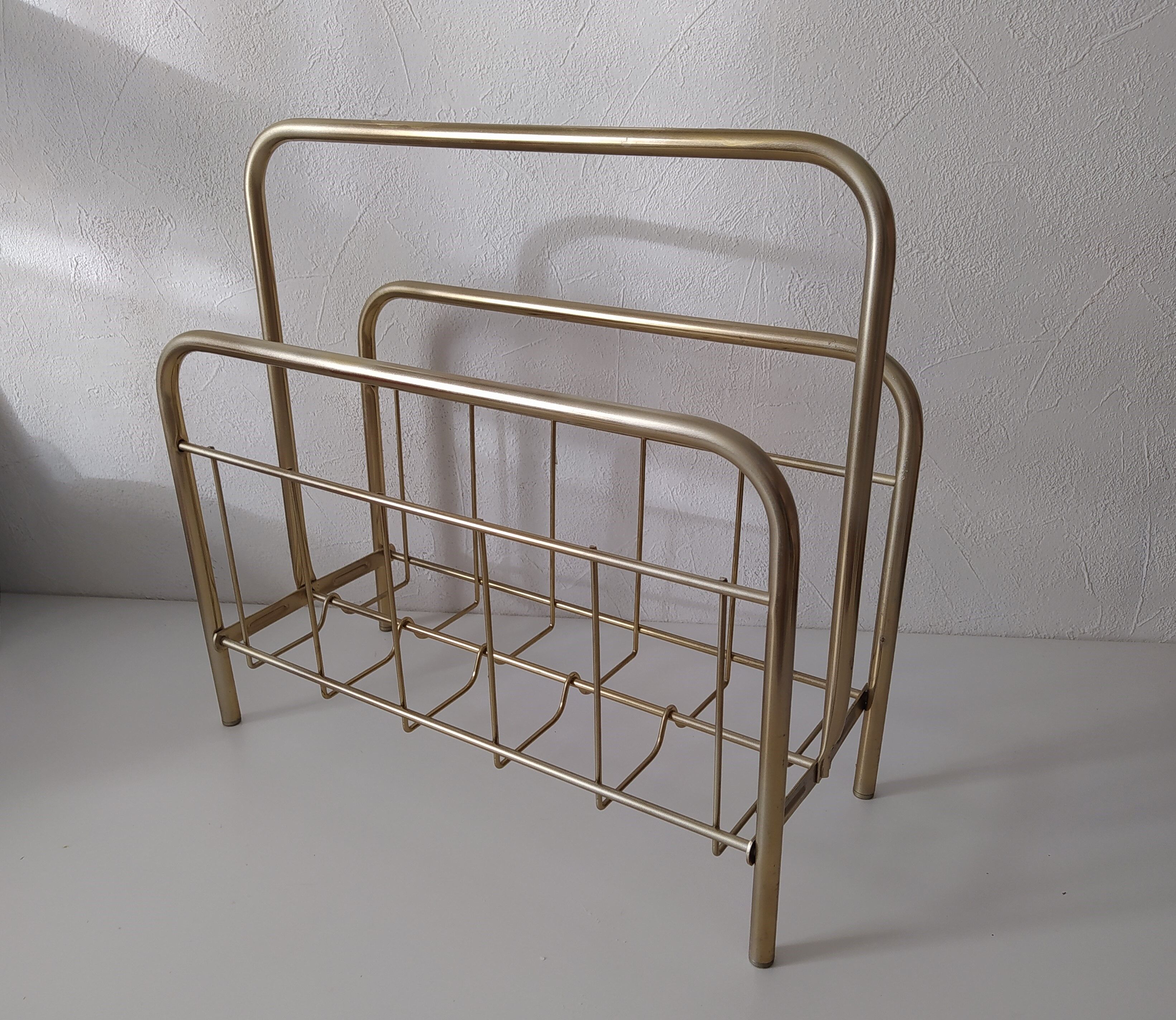 Vintage magazine holder in golden brass
