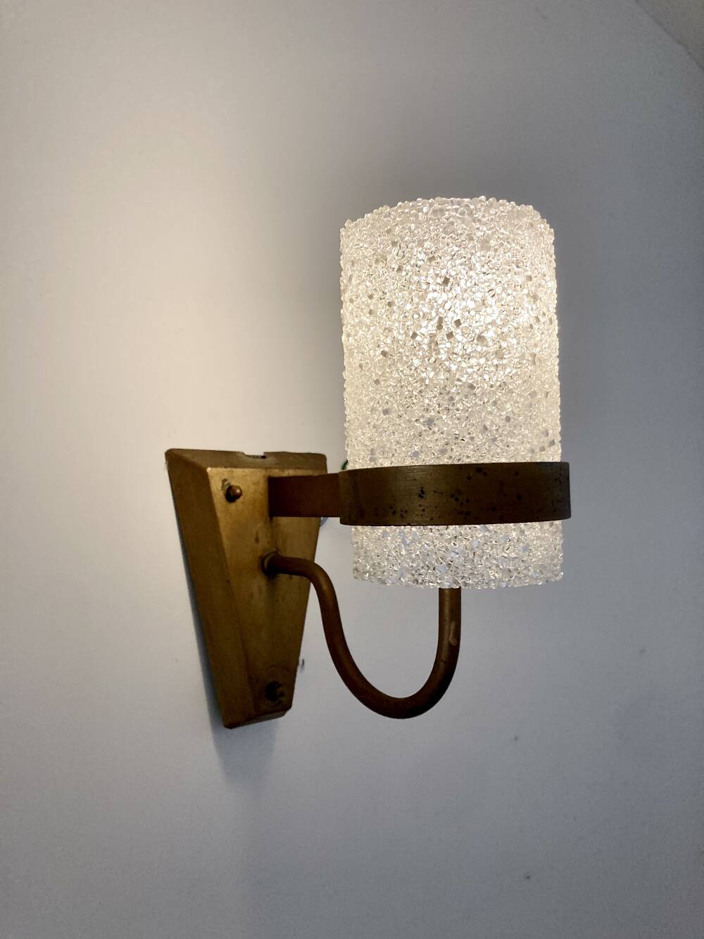 Set of three wall sconces in gold metal and ice effect Perspex, 1960-70.