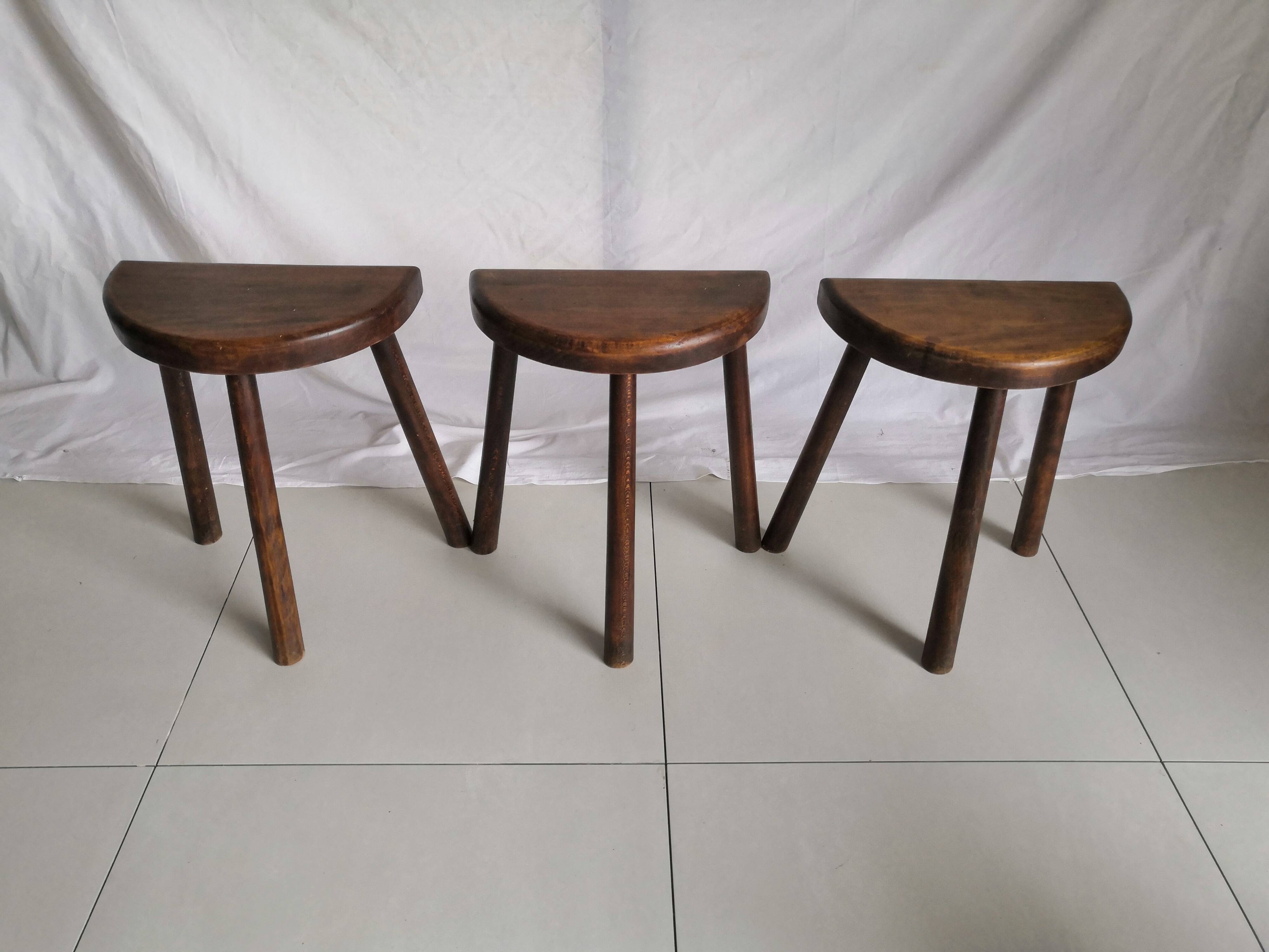 Trio of vintage brutalist tripod stools