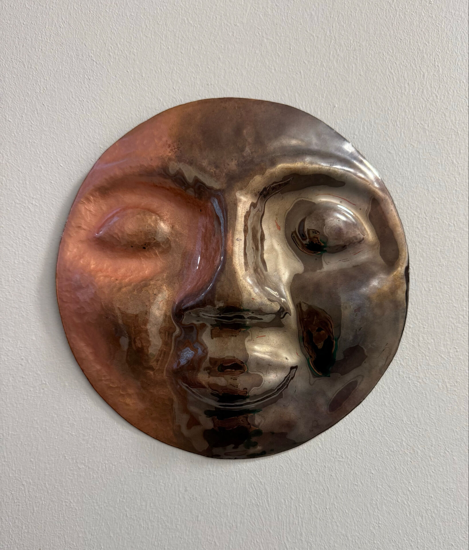 Sculpture face in embossed enamelled brass from the 1960s.