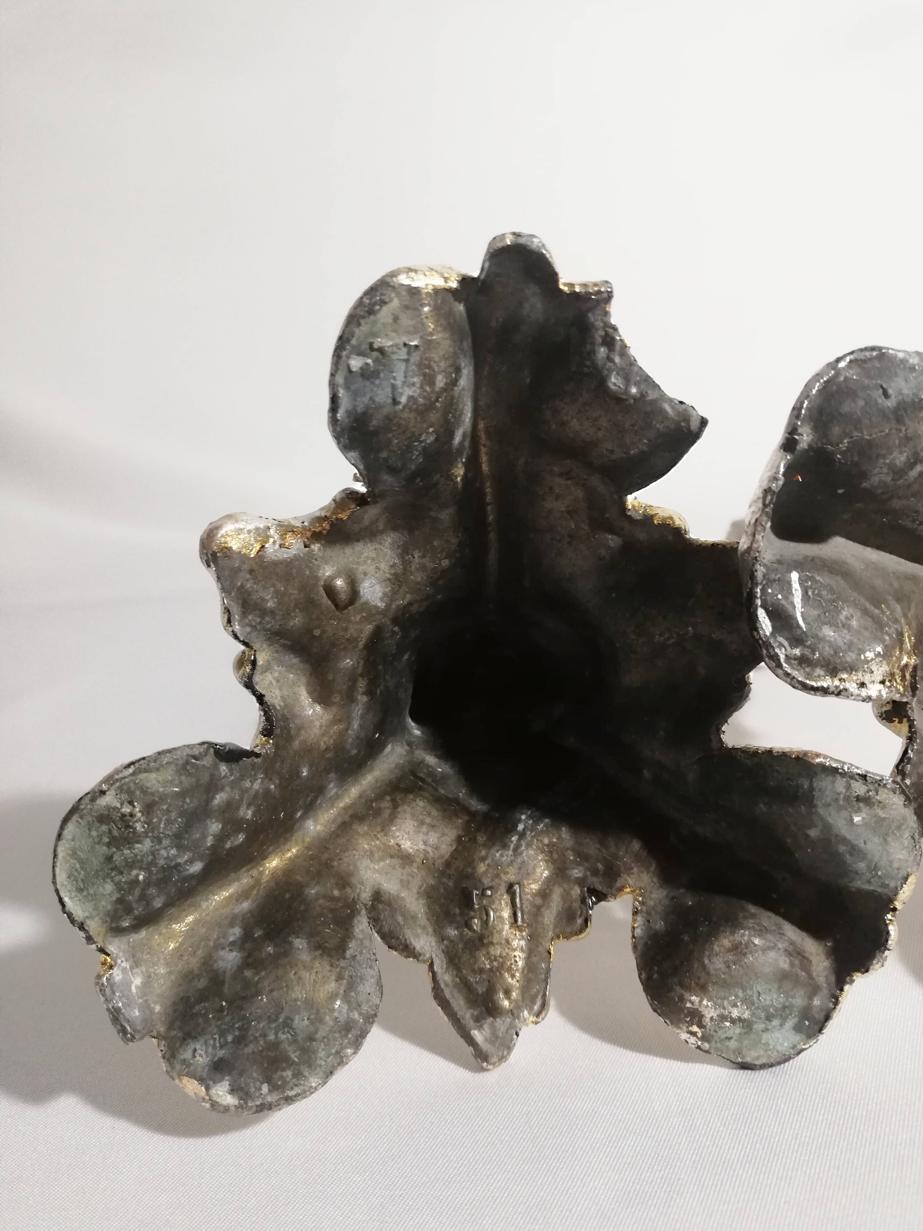 Pair of candlesticks restored to silver leaf
