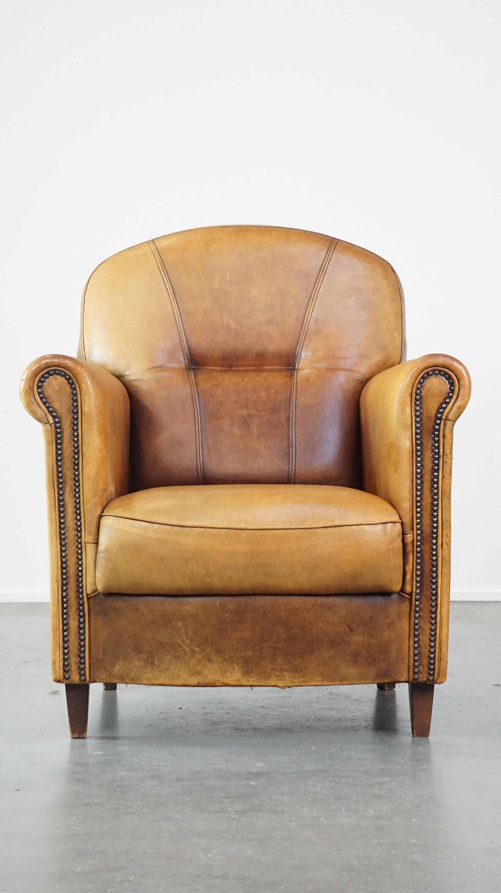Stately, sleekly finished, comfortable sheepskin armchair