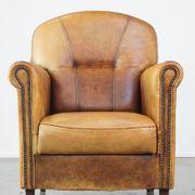 Stately, sleekly finished, comfortable sheepskin armchair