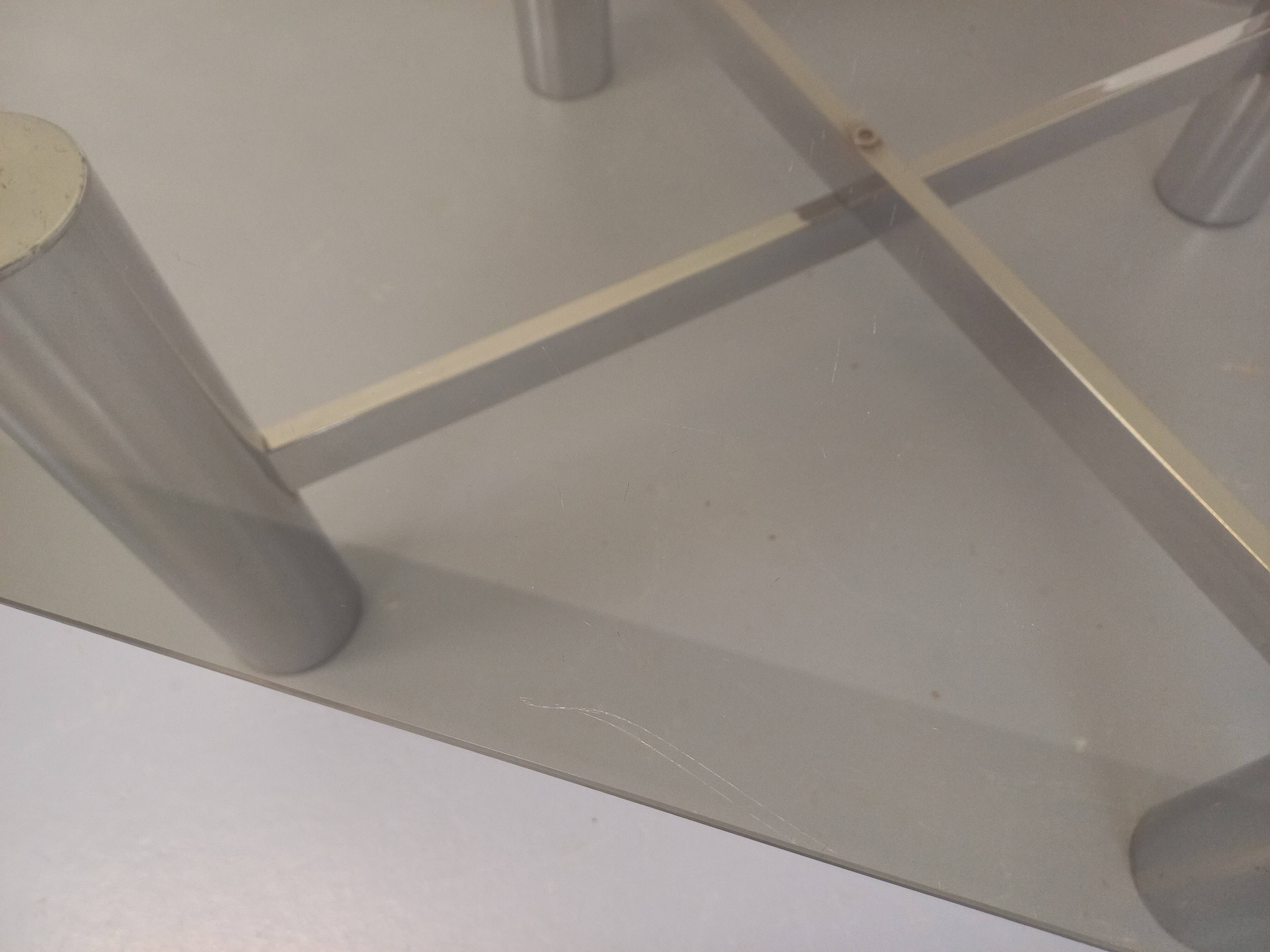Square Italian vintage Space Age coffee table in smoked glass and metal.