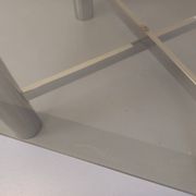 Square Italian vintage Space Age coffee table in smoked glass and metal.