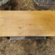 Designer coffee table in brushed stainless steel and light-tinted solid oak top