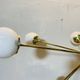 Lampadario Sputnik in ottone con sfera in bronzo e vetri opalini – Italia,