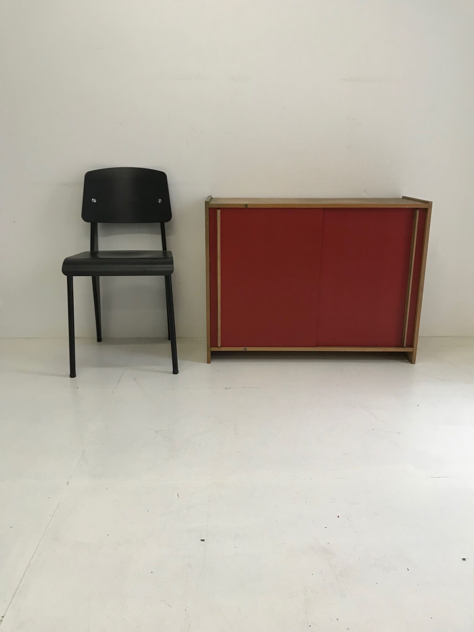 Vintage furniture with red sliding doors