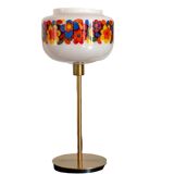 Table lamp with a vintage “flower power” glass globe and a gold base