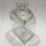 Bouteille en verre décoré de motifs doré