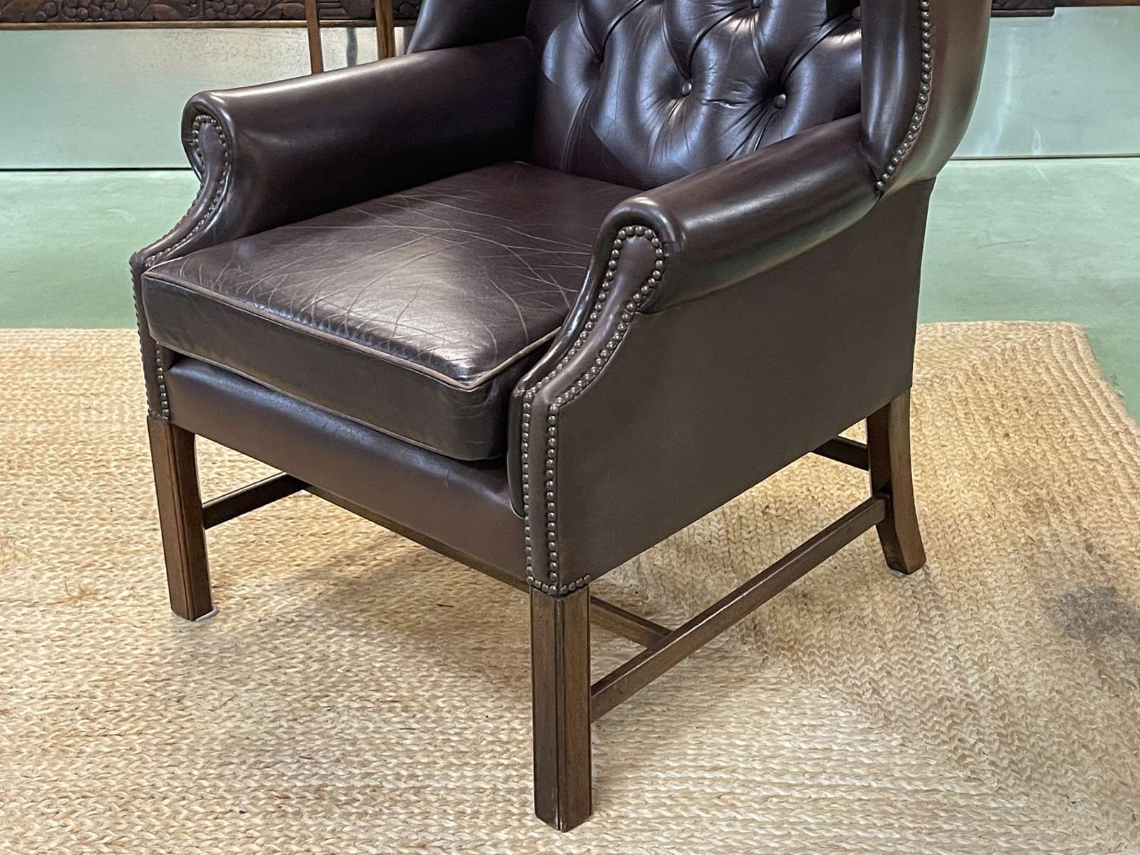 Chesterfield armchair with brown leather ears from the 1990s in very good condition