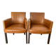 Chair with armrests in aged brown cowhide leather