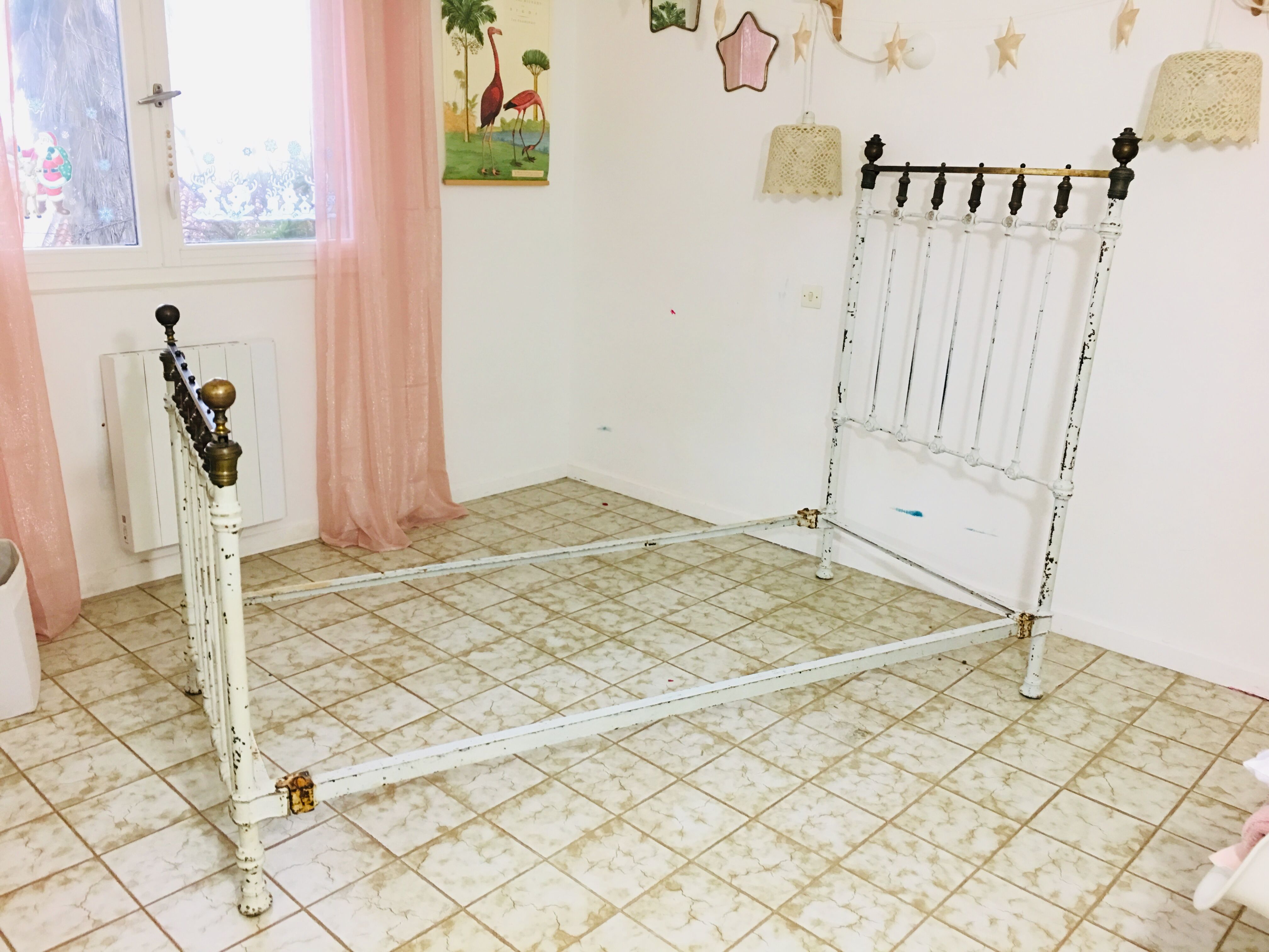 Old white metal and brass bed