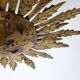 Mid-century sun ceiling lamp in gilded metal with leaf rays, 1950s