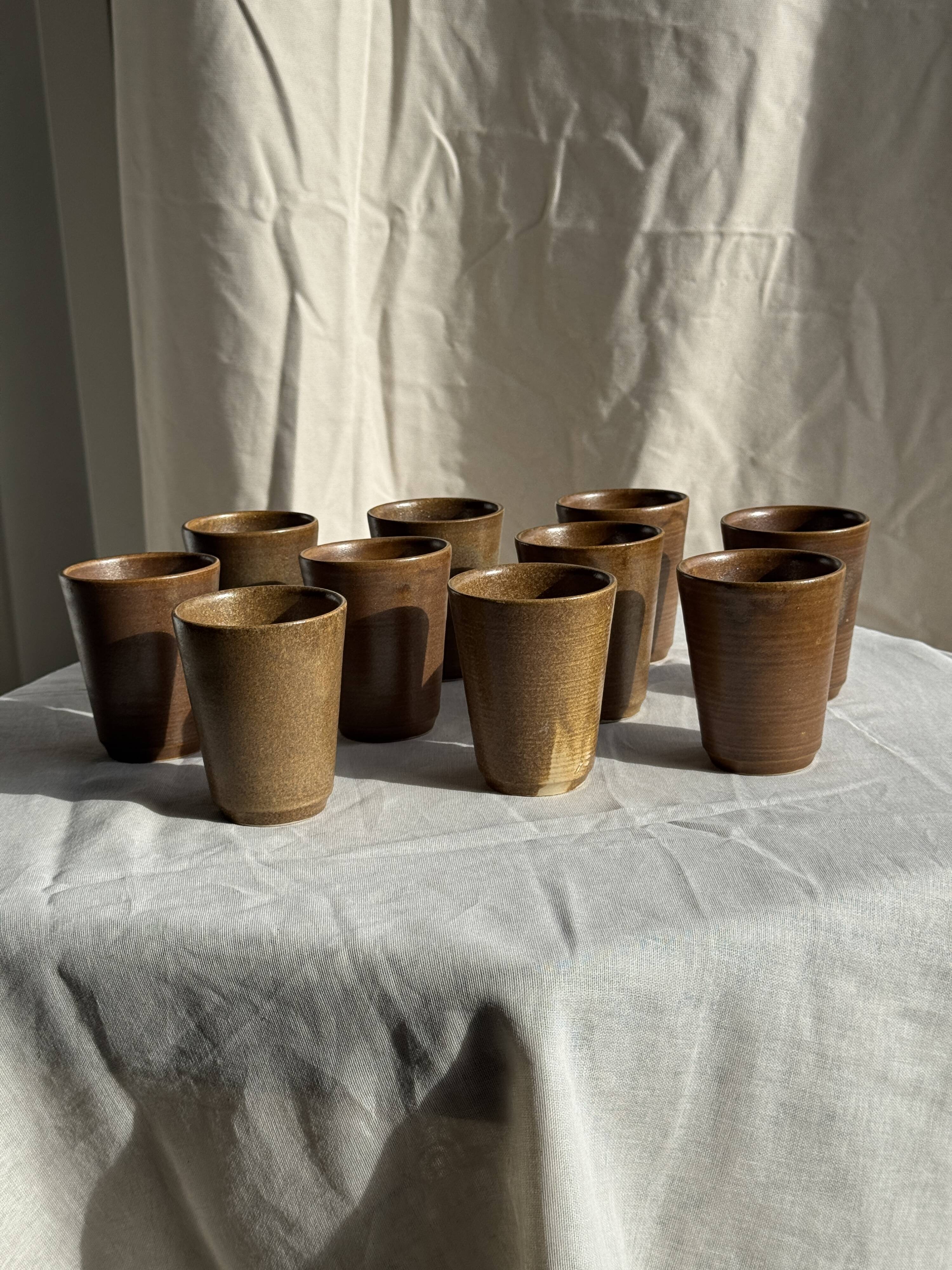 Set of 10 small stoneware mugs from Digoin.