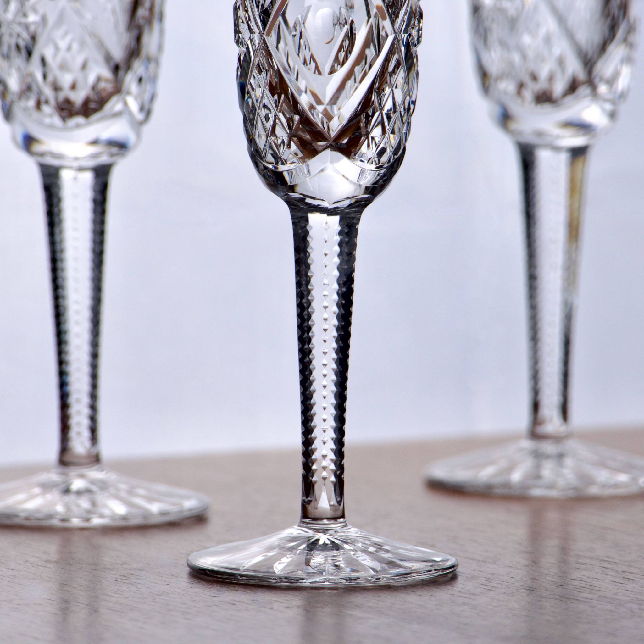 Large antique hand-cut crystal champagne flutes signed LS
