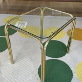 Pair of small nesting coffee tables in gold tubular metal & transparent glass tops