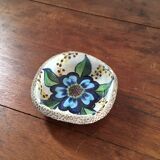 Cup lava foam with blue flower.