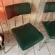 Pair of green faux leather chairs