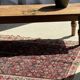 Brown Indonesian teak coffee table, with a border and cylindrical legs H40 L103.