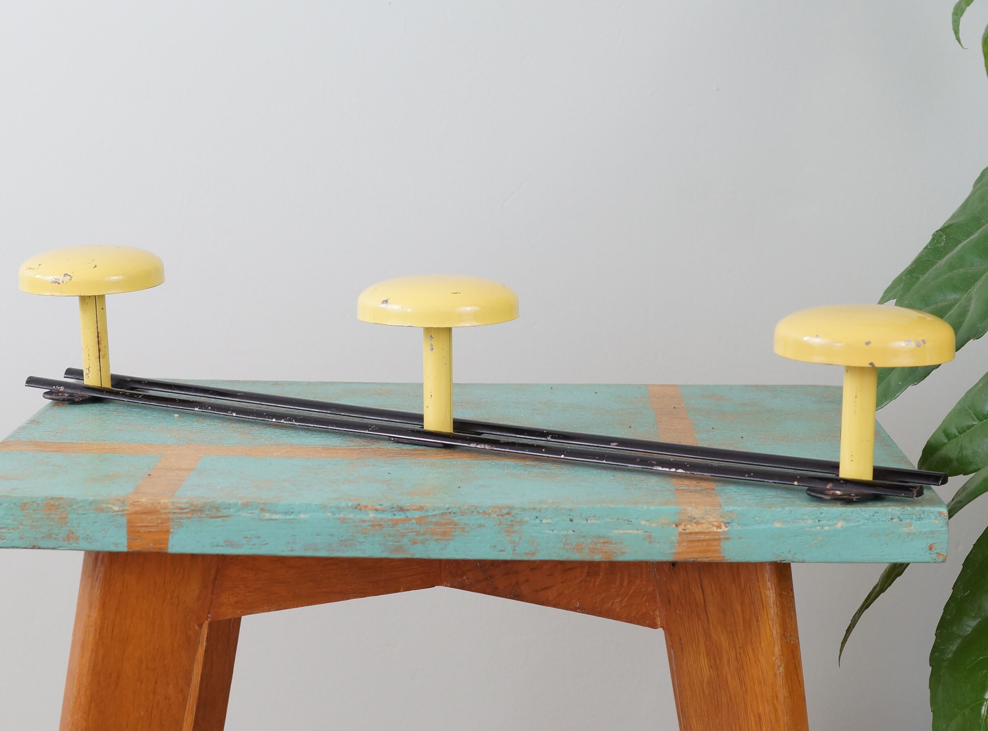 Yellow and black enamelled metal hook, 60s