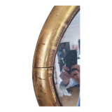 Oval mirror with gold leaf