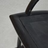 Black leather armchair and canning