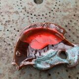 Empty pocket in glazed ceramic slip in the shape of vintage fish