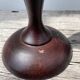 Trio of large turned wooden candlesticks