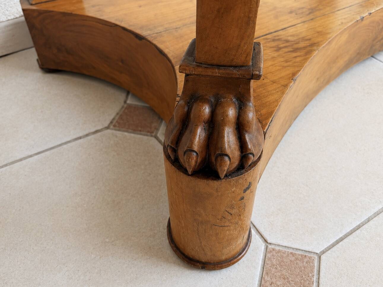 French console from the 19th century in cherry wood and black marble, with claw feet.