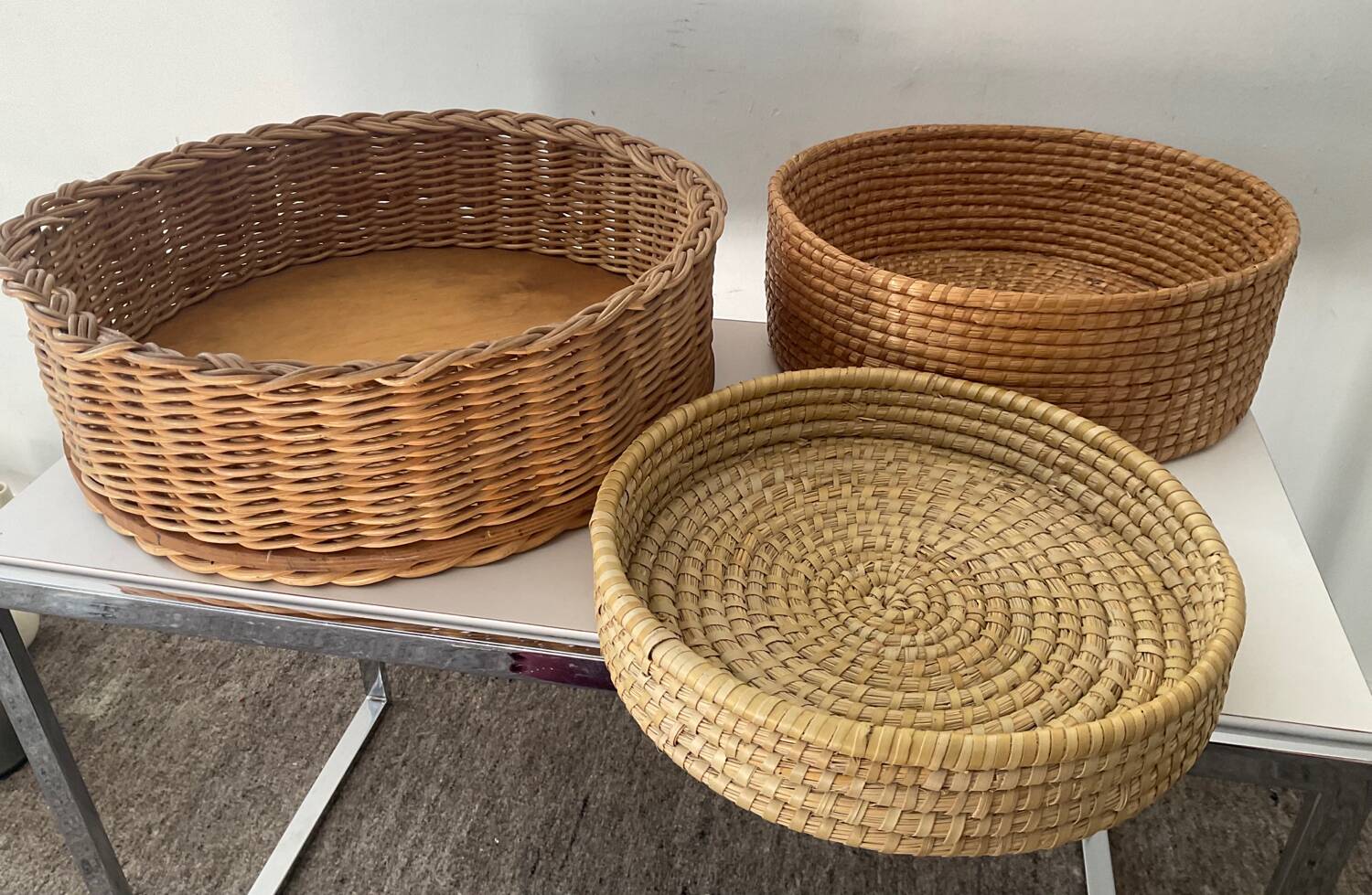 Trio of vintage wicker and woven raffia baskets