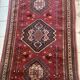 Large antique Oriental hallway carpet made of hand-knotted wool.